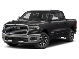 A dark grey RAM pickup truck with a chrome grille on a dark background
