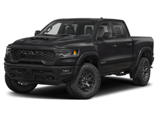 A matte black RAM pickup truck with off-road tires on a dark background