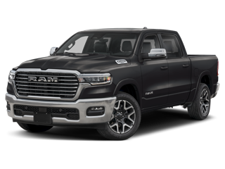 A dark grey RAM pickup truck with a chrome grille on a dark background