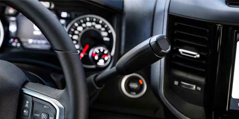 A close-up view of a truck’s interior showing the steering wheel